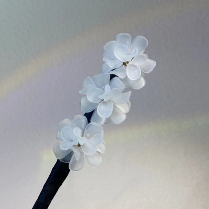 Dutt hårspänne blommor vridklämma enkla uppsättningar 2026