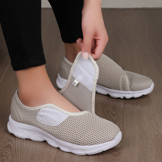 Adjustable orthopedic unisex sneakers with velcro closure and mesh design.
